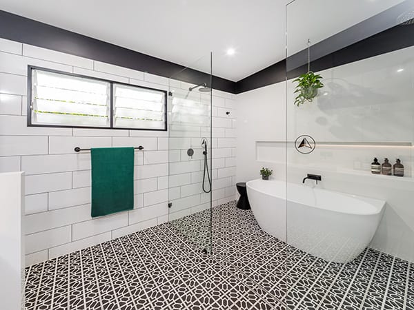 pattern bathroom floor tiles in a bright bathroom renovation after photo