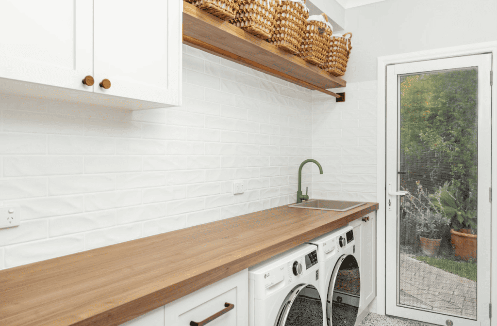 Laundry benchtop and custom cabinetry.