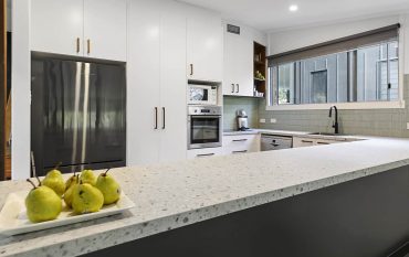 Modern white kitchen renovation after photo