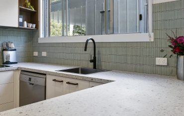 Close-up of the counter and wall tiles in a modern kitchen renovation